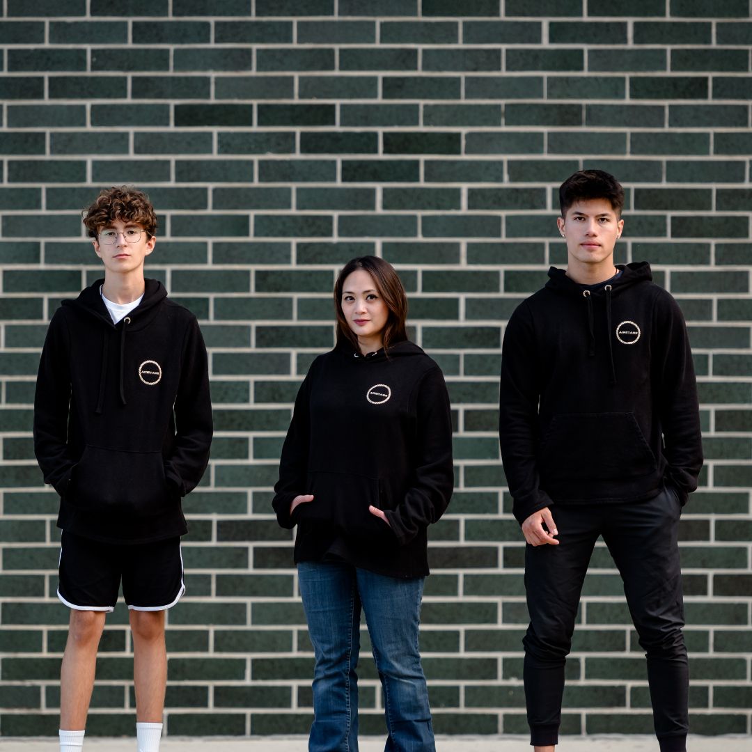 group of 3 people wearing black hemp pullover